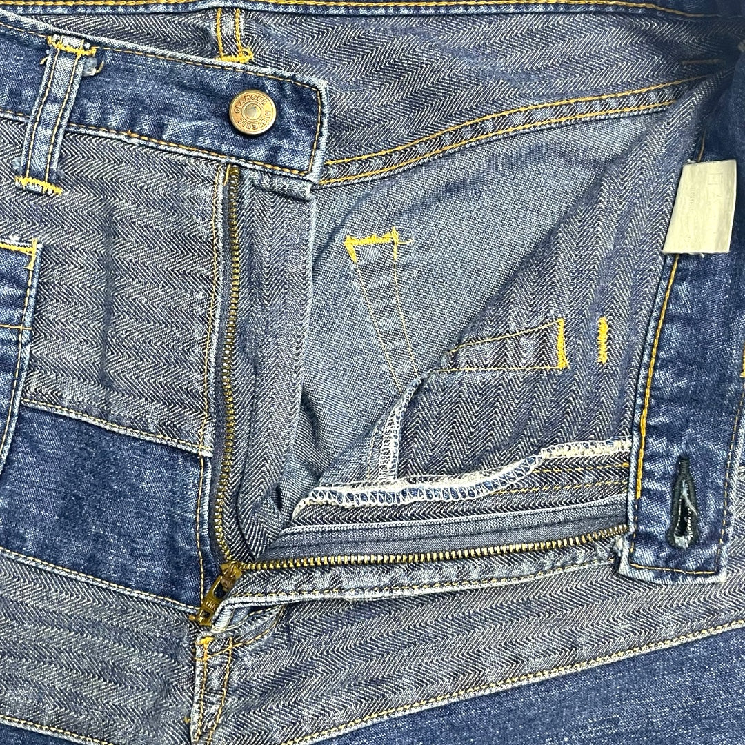 Close-up of a blue denim jacket with stitching details
